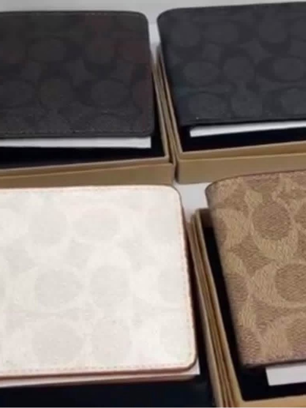 Coach Bifold Card Holders in Black, Brown, and Cream